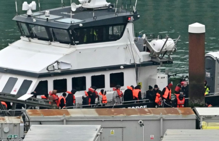 Hundreds were picked up and brought ashore to Dover in southeast England on Wednesday