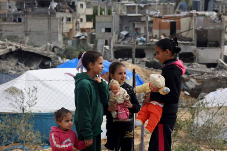 Palestinian children play at a makeshift camp in Rafah in the southern Gaza Strip on January 28, 2024