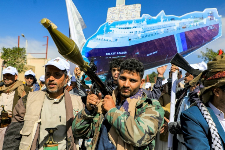 A sign depicts the cargo vessel Galaxy Leader, which was seized by Yemen's Huthi rebels, at a pro-Palestinian rally in the Huthi-held capital Sanaa on February 7, 2024