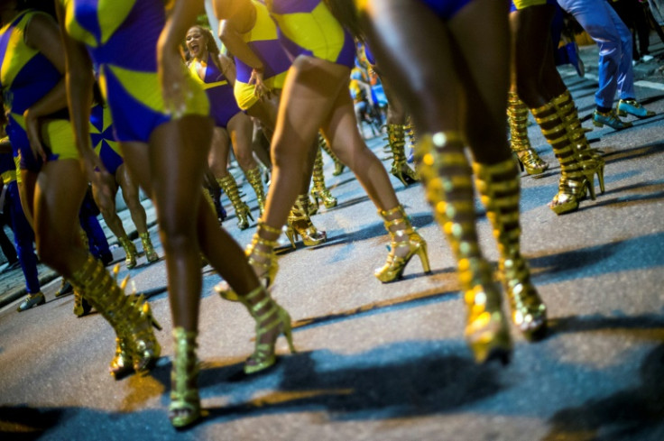 Members of the Paraiso do Tuiuti samba school perform during a street rehearsal ahead of Rio's carnival parade contest