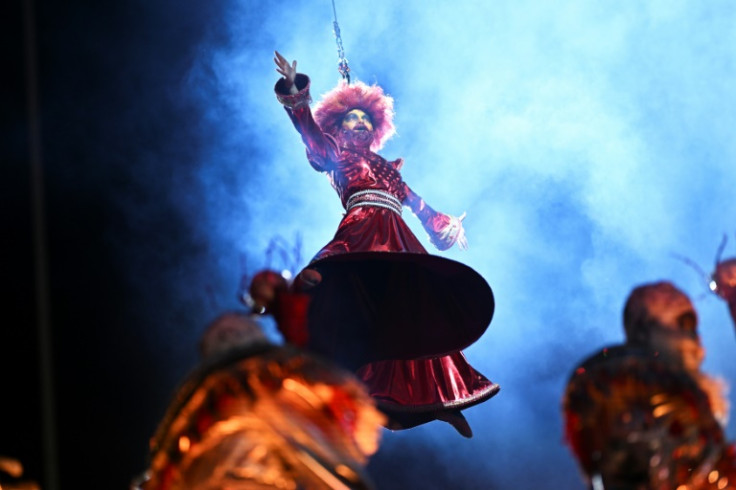 A member of the Porto da Pedra samba school performs during the first night of the Carnival parade at the Marques de Sapucai Sambadrome in Rio de Janeiro, Brazil on February 11, 2024