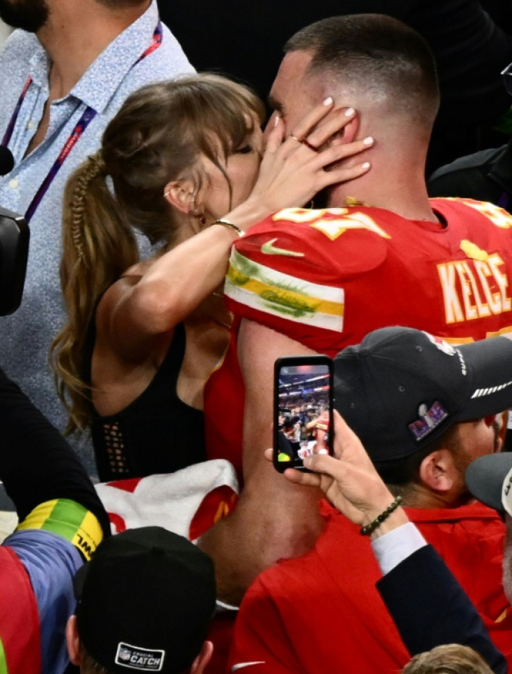 The presence of US pop icon Taylor Swift, seen here kissing her partner Travis Kelce after his Kansas City Chiefs won the Super Bowl, may have boosted viewership of the NFL championship game to a record level