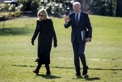 US President Joe Biden waves as he and First Lady Jill Biden arrive at the White House in Washington on February 19, 2024