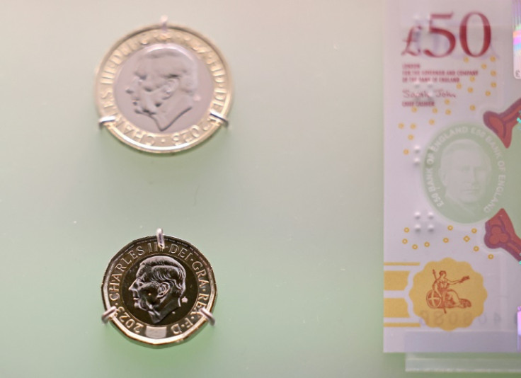 Banknotes and coins featuring King Charles III's image are pictured on display during a photocall for 'The Future of Money' exhibition, at the Bank of England Museum in London on February 27, 2024