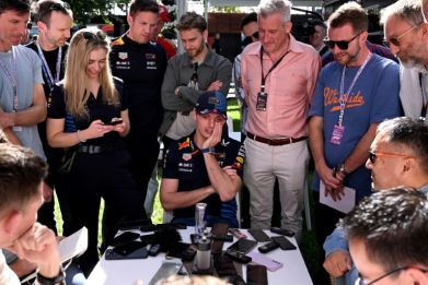Red Bull's Max Verstappen (C) speaks to the media at the Australian Grand Prix