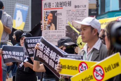 Dozens joined a rally in Taipei on Saturday afternoon to protest the law