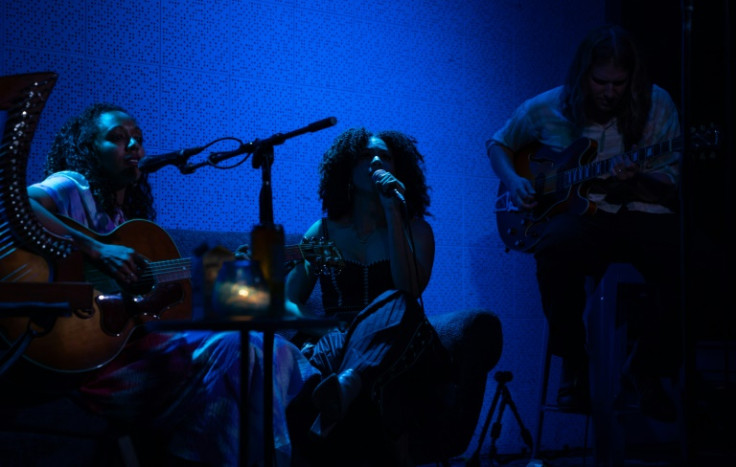 Julie Williams (C) sings with Lizzie No at the Blue Room in Nashville