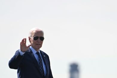 US President Joe Biden waves as he walks to board Air Force One at Philadelphia International Airport in Philadelphia, Pennsylvania, on April 8, 2024.  Biden is traveling to Madison, Wisconsin, and Chicago, Illinois.