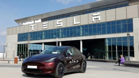 A Tesla car stands in front of the company's electric car plant in Gruenheide near Berlin, Germany, on March 13, 2024