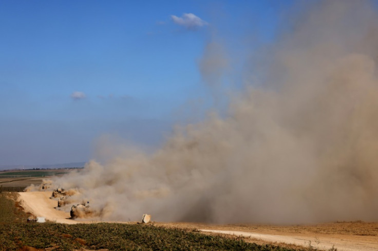 Israeli armoured personnel carriers near the border with the besieged Gaza Strip, where fighting rages nearly eight months into the war