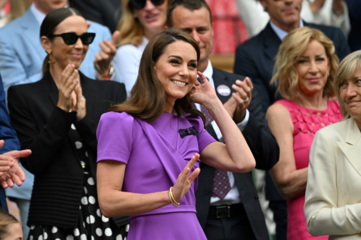 Catherine, Princess of Wales, waves as she takes her seat at Wimbledon's Centre Court