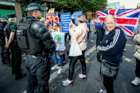 Several dozen anti-immigration demonstrators also turned out in Belfast