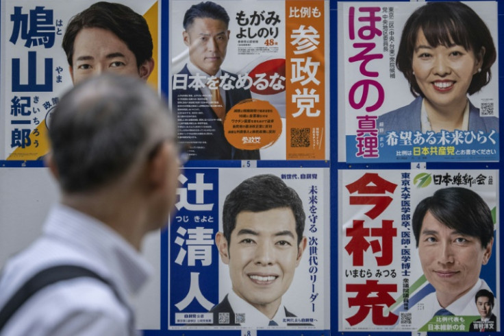 A man looks at campaign posters for the Japan's election in Tokyo. A record number of women are contesting the October 27 poll, but still less than a quarter of candidates