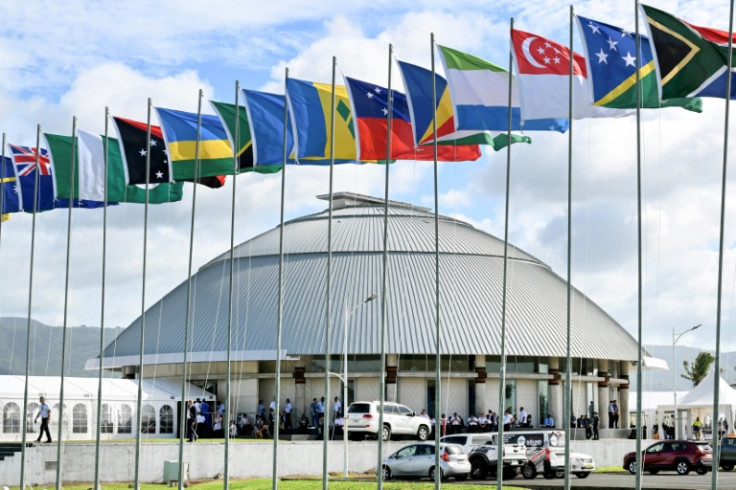 Commonwealth flags fly outside the parliament of Samoa during the Commonwealth Heads of Government Meeting in Apia