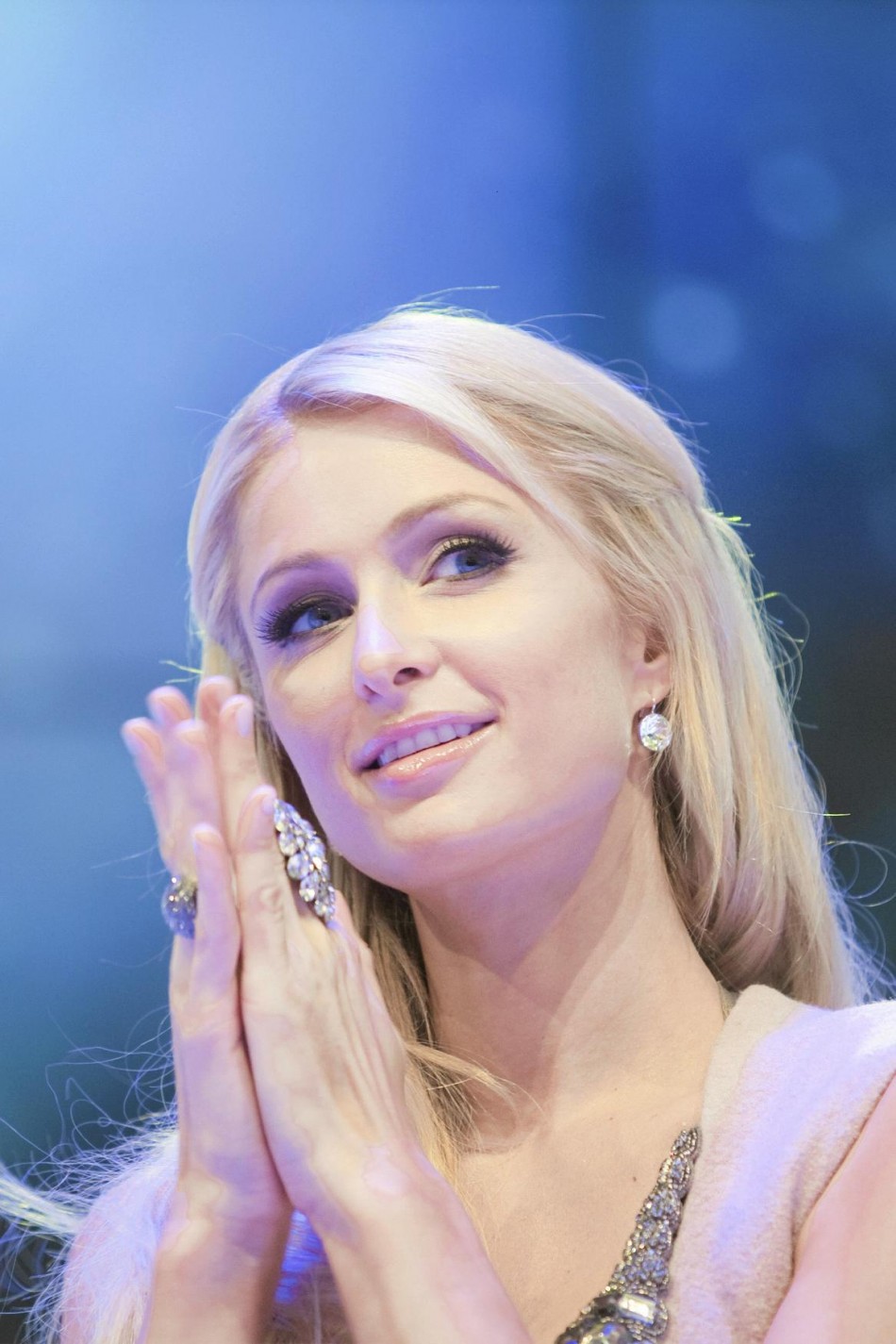 Paris Hilton smiles as she attends an opening ceremony of a shopping center in Katowice.