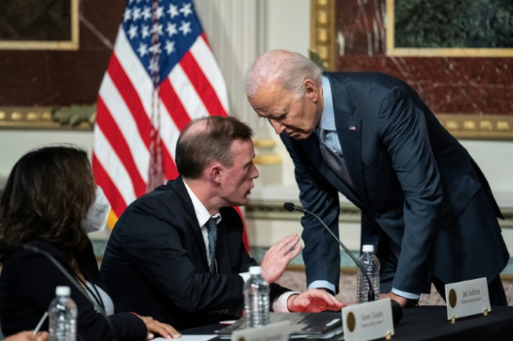 US President Joe Biden confers with his National Security Advisor Jake Sullivan in Washington on October 11, 2023