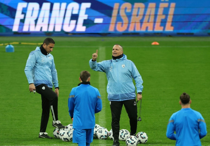 Israel head coach Ran Ben Shimon addresses his players in training before their match against France at the Stade de France in Paris on Thursday