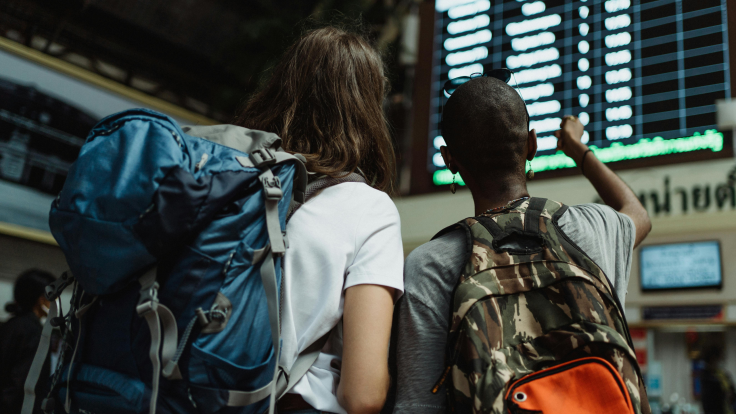 Women looking at travel cartel