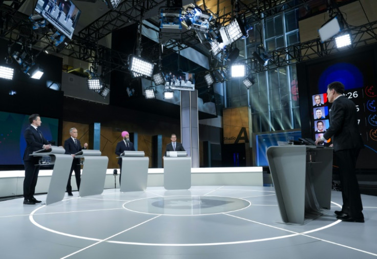 Conservative Leader Pierre Poilievre, Canadian Prime Minister and Liberal Party chief Mark Carney, New Democratic Party Leader Jagmeet Singh, Bloc Quebecois Leader Yves-Francois Blanchet and Debate moderator Steve Paikin, during an election debate in Mon