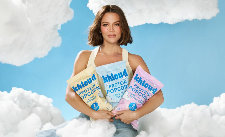 Khloe Kardashian posing with Khloud Foods’ Protein Popcorn
