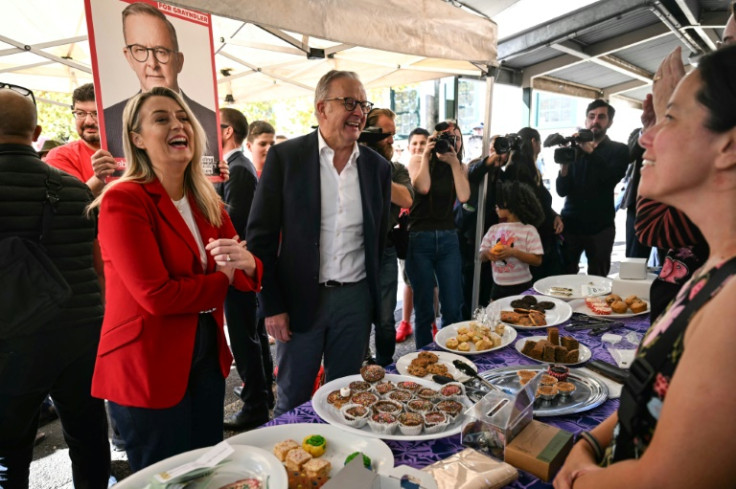 Australia's Prime Minister Anthony Albanese and his partner Jodie Haydon arrive to vote in the general election at a polling station in a primary school in the suburb of Marrickville in Sydney on May 3, 2025. Millions of Australians voted on May 3 in a bi