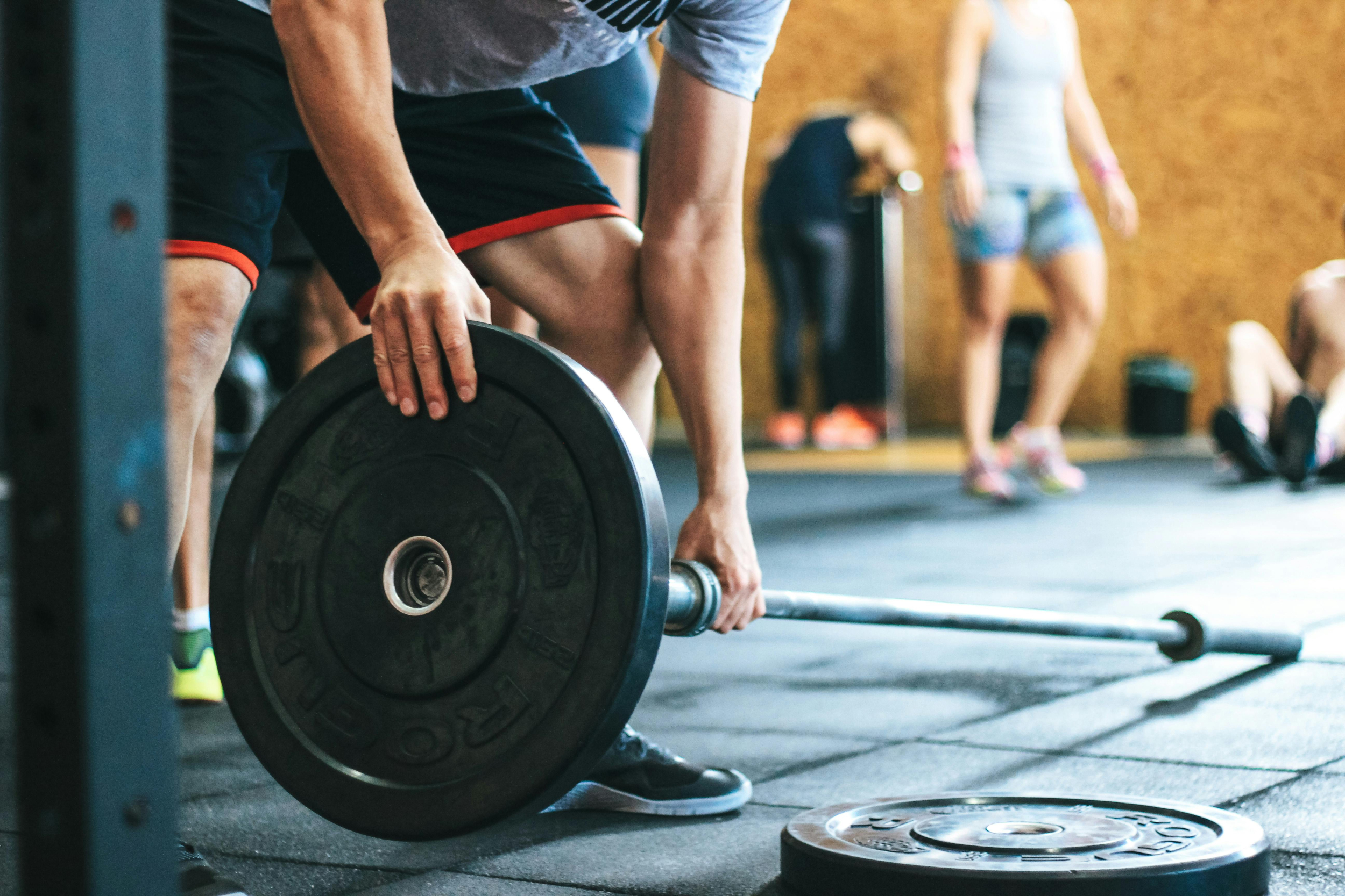 CrossFit athlete preparing equipment for the final Open workout