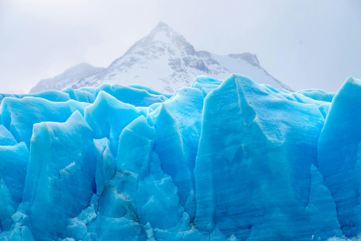 Blue glaciers with mountain on the background