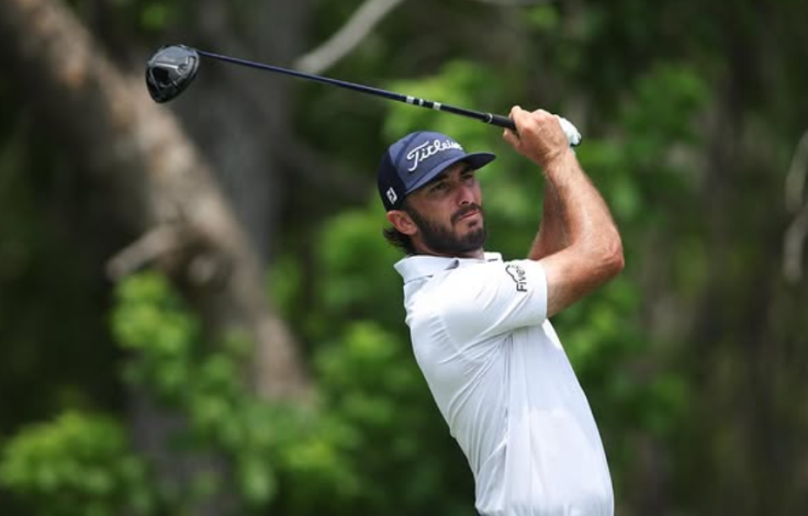 Max Homa holding a golf club