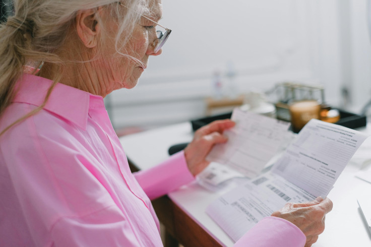 Elder with Bills