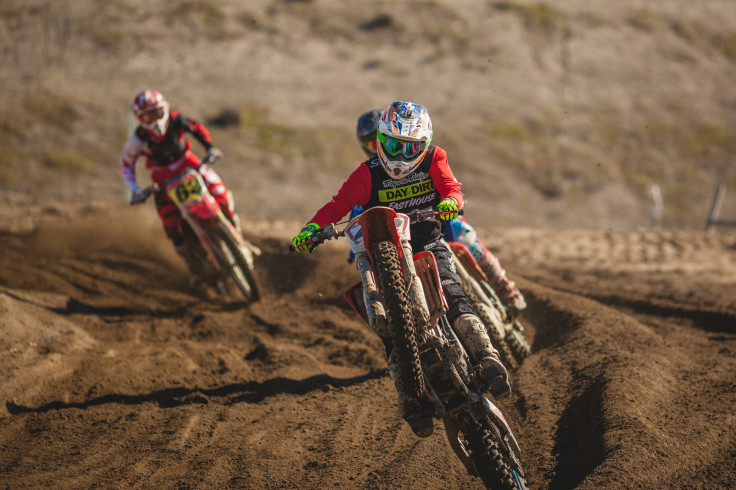 Man riding motocross dirt motorcycle during daytime