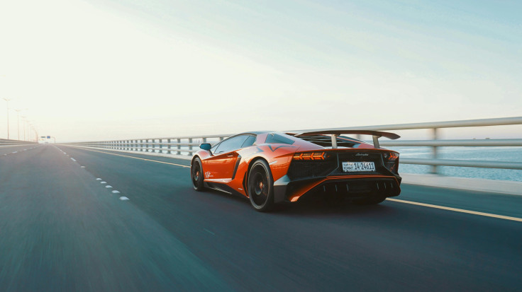 Orange Lamborghini on a highway