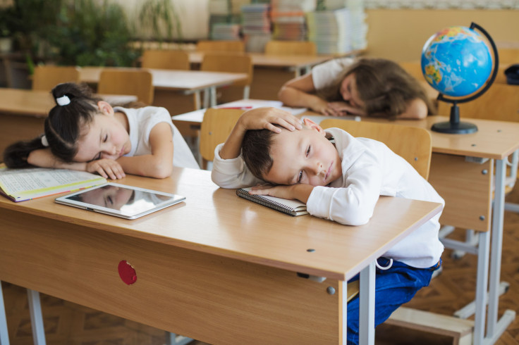 School Children Lying Desks Napping