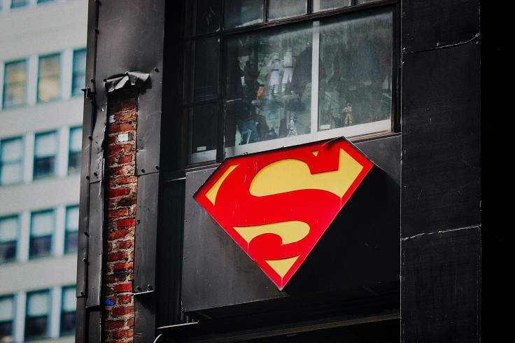 Superman logo on black wooden door