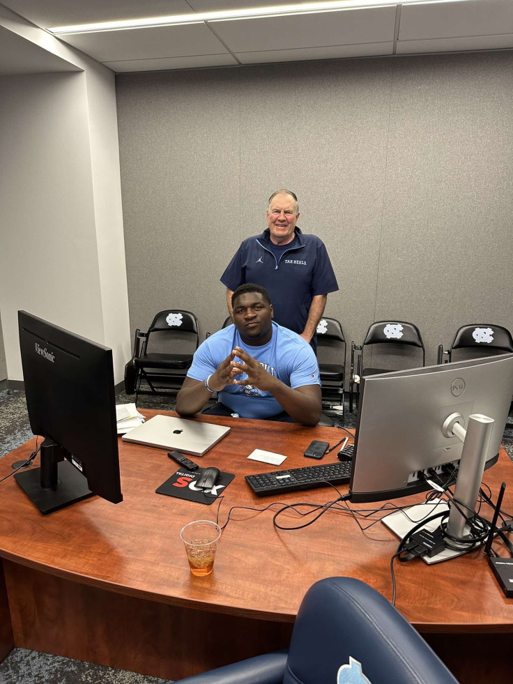 Bill Belichick with Dereon Albert