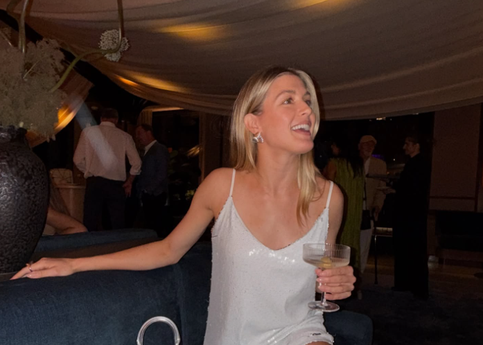 Eugenie Bouchard holding a glass