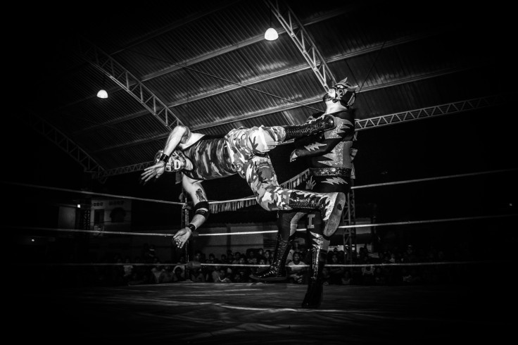 two men wrestling in a ring