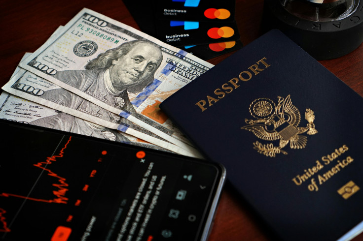 Dollar bills and a US Passport