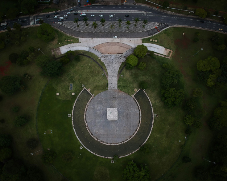 Aerial photo of grass field and tomb during daytime