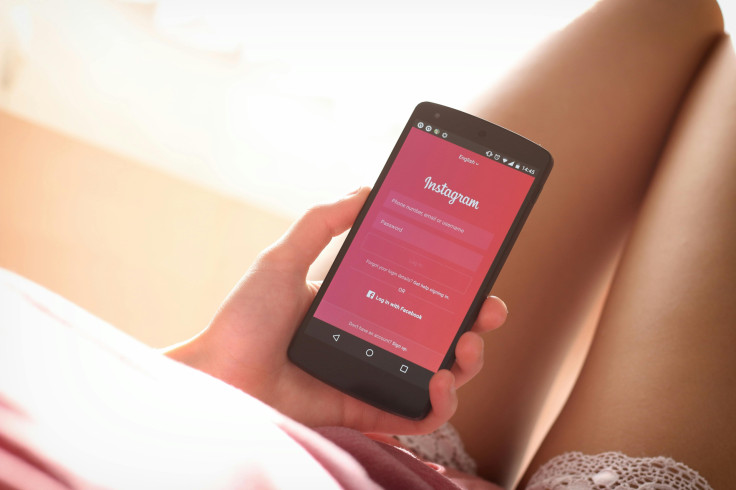 Person holding a phone with Instagram