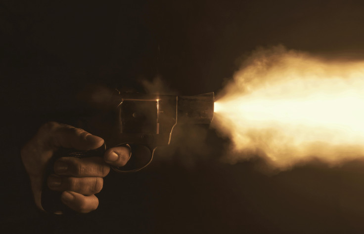 Hand firing a gun