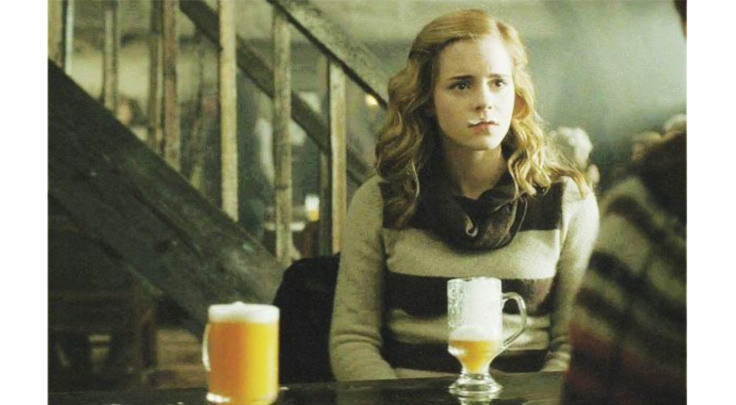 Hermione drinking butterbeer in Harry Potter