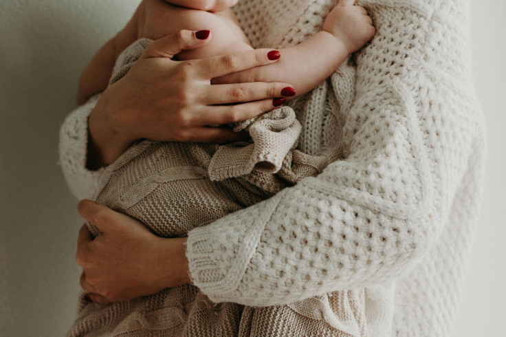 Baby in its mother's arms