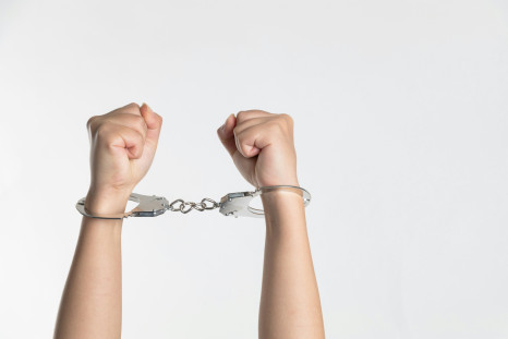 Person showing handcuffs