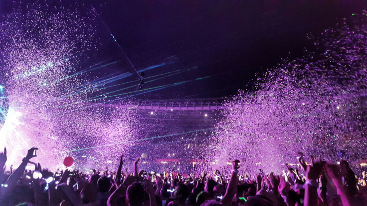 People watching a concert at night time