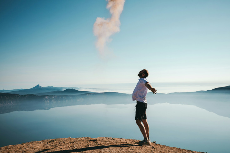 man standing on sand