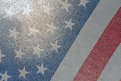 A close up of an american flag with stars on