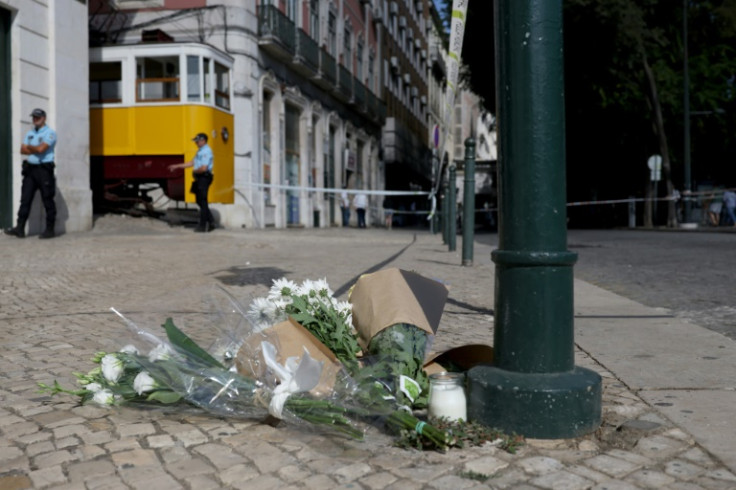 The government declared a day of mourning and people gathered to lay flowers near the cordoned-off crash site