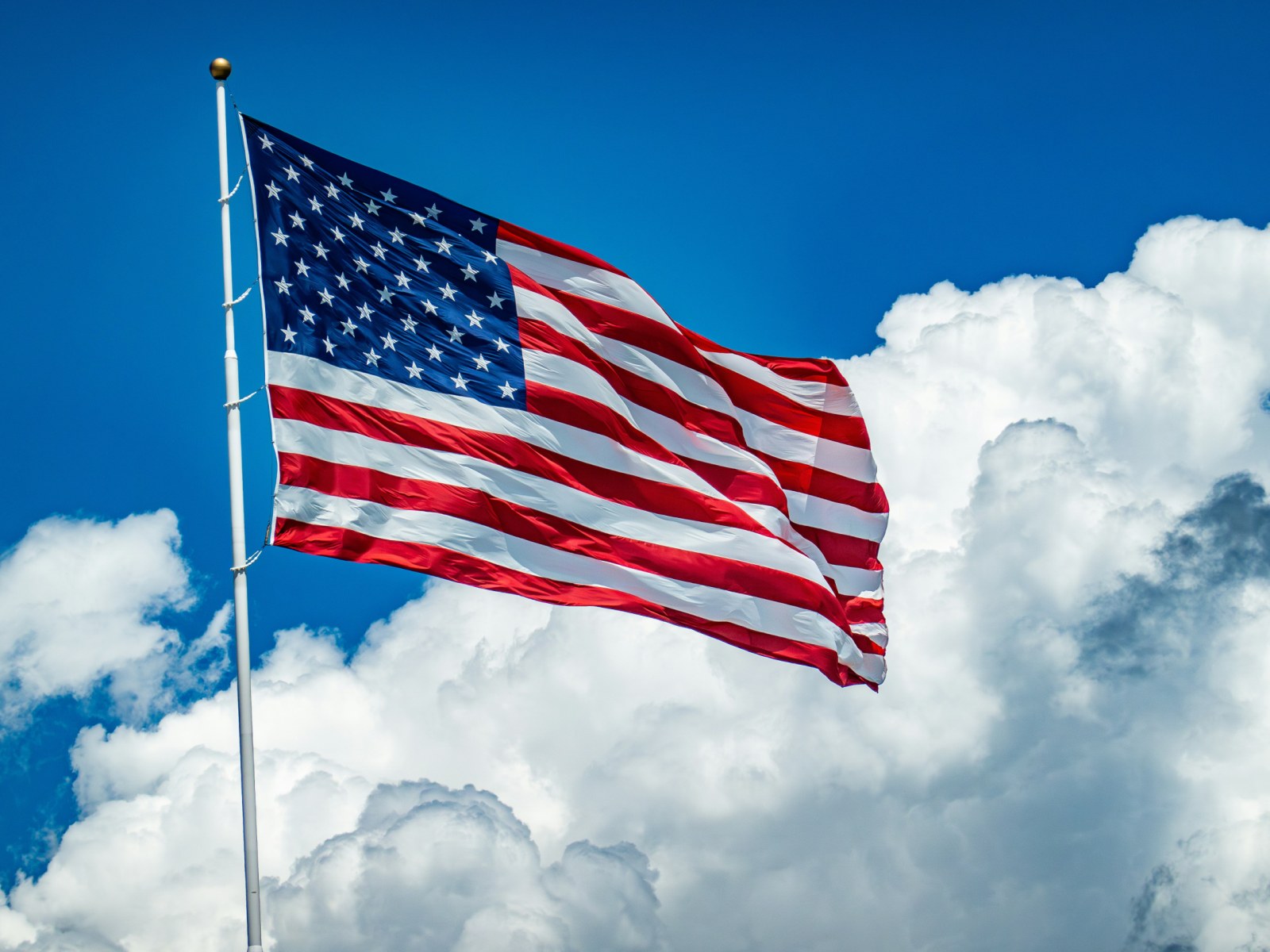 An American flag flying high in the sky