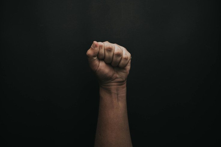 A fist with black background