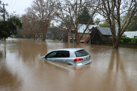 A car through a flooded street